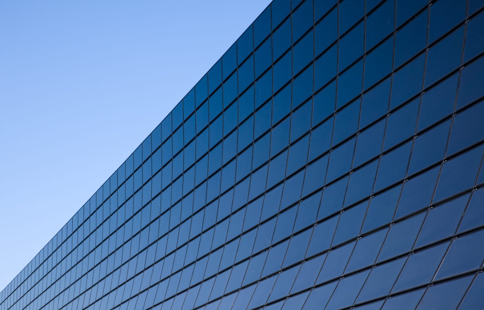Modern architecture with reflective glass — leadership growth and transformation